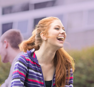Red-headed female laughing